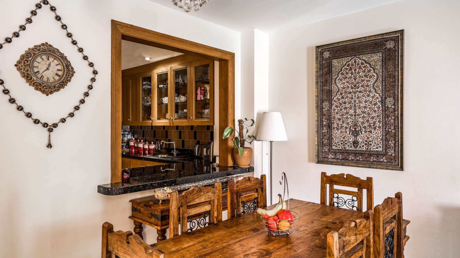 Hallway in two-bedroom apartment, Yansoon, Old Town, featuring artwork and warm lighting