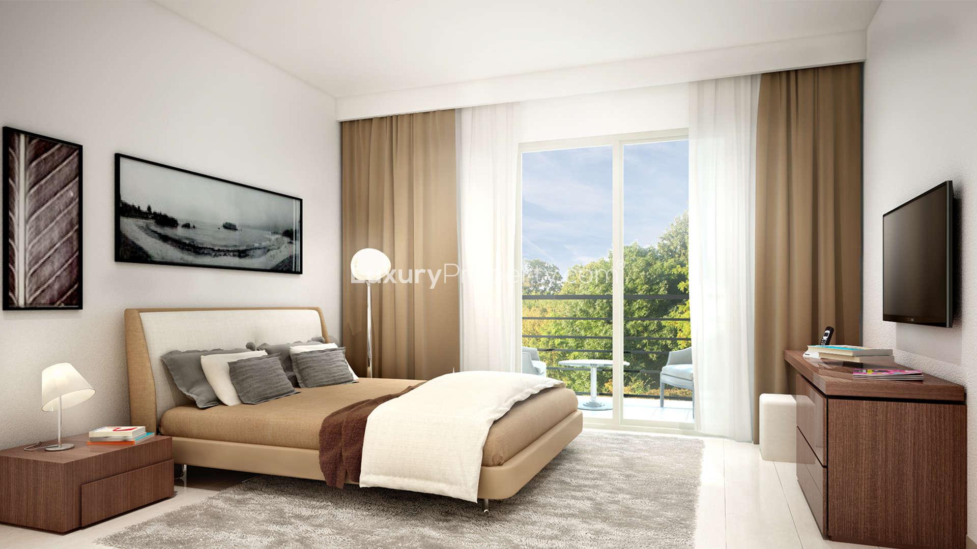 Modern dining and kitchen area in Safi Apartments, Town Square Dubai. Luxurious 3-bedroom layout