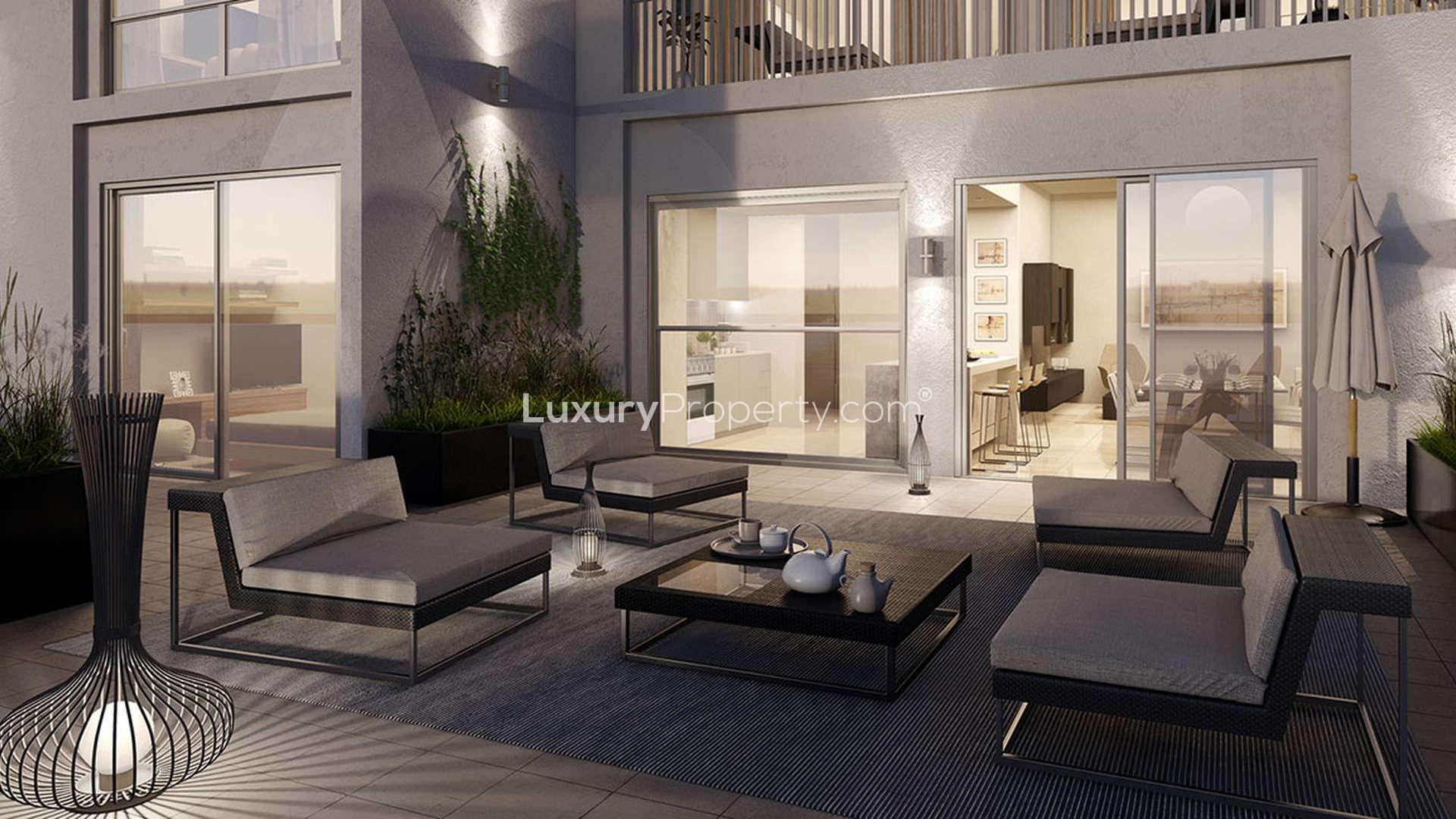 Luxurious bedroom in Safi Apartments, Town Square Dubai, with modern decor and balcony view