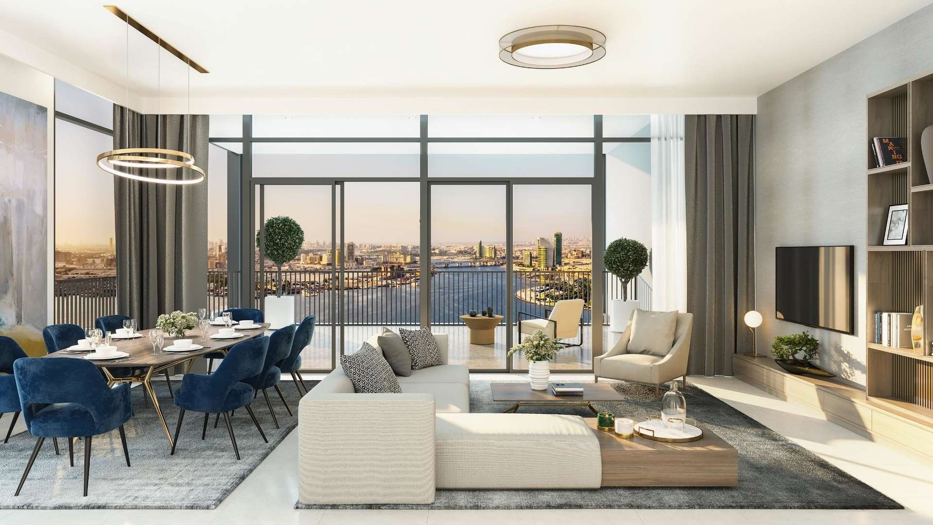 "Modern high-rise apartment buildings at Creek Edge, Dubai Creek Harbour, illuminated at night.",Modern living room with city skyline view in Creek Edge apartment, Dubai Creek Harbour