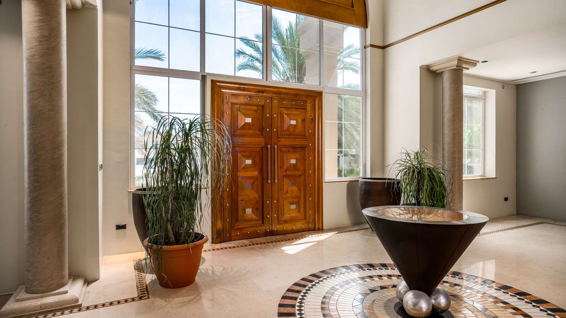 Exquisite six-bedroom villa exterior in Al Manara, Jumeirah with lush landscaping