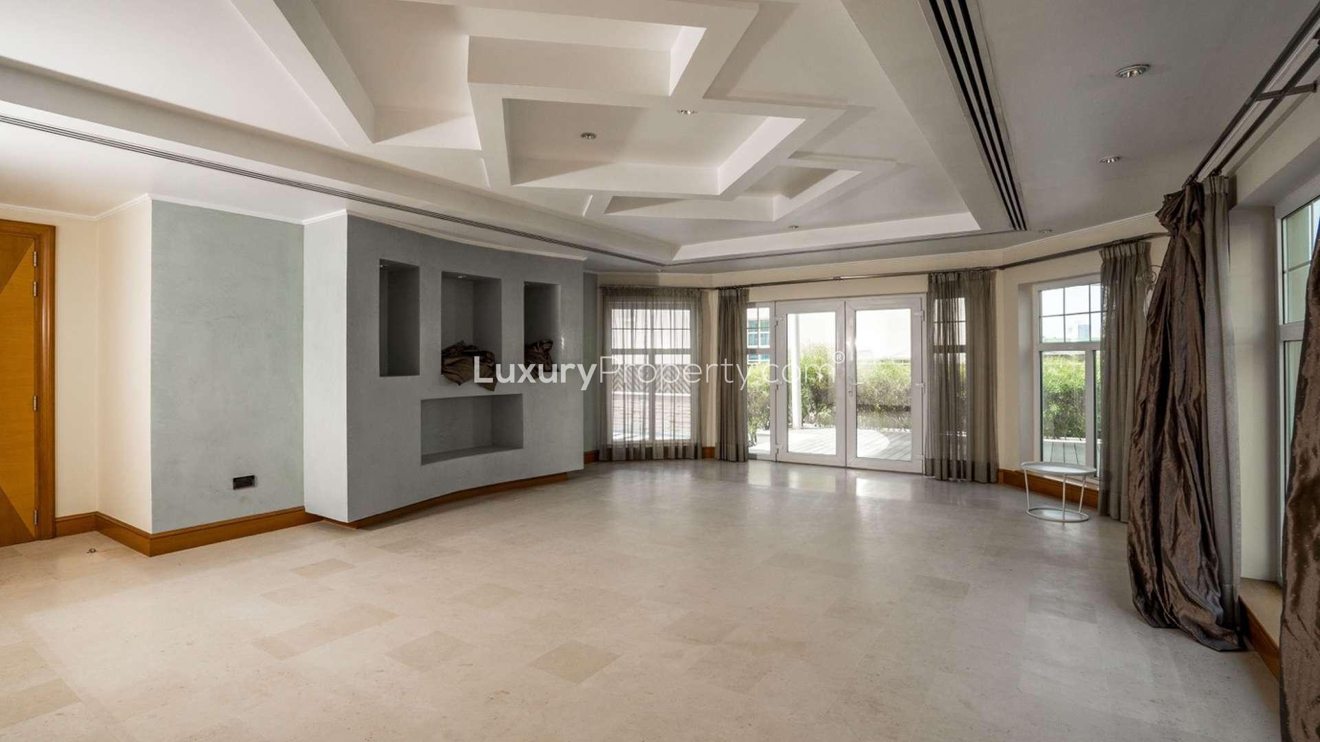 "Elegant entrance of six-bedroom villa for sale in Al Manara, Jumeirah, with decorative elements.",Luxury interior of six-bedroom villa with elegant lighting in Al Manara, Jumeirah