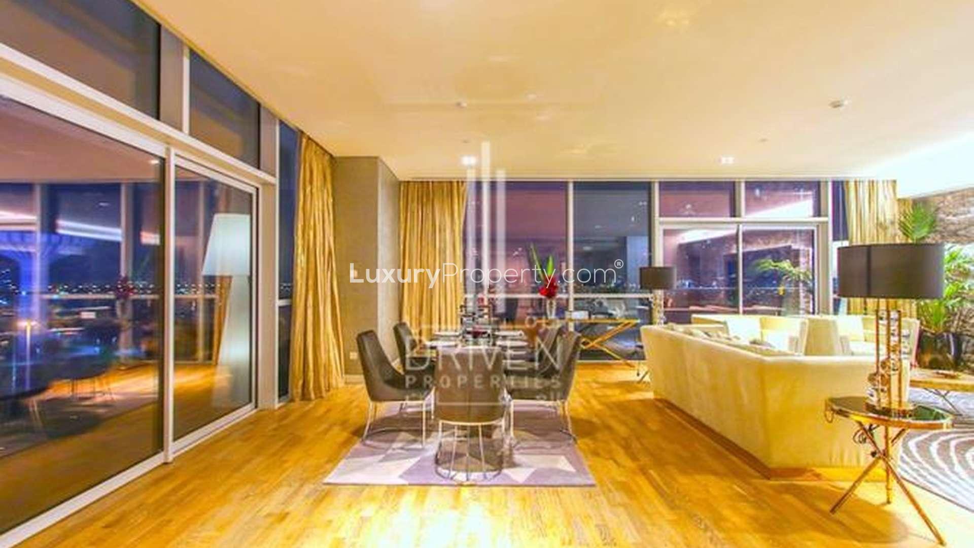 "Luxurious City Walk penthouse balcony view at sunset, Building 10, for sale.",Luxurious living area in fully upgraded City Walk penthouse, Building 10, for sale