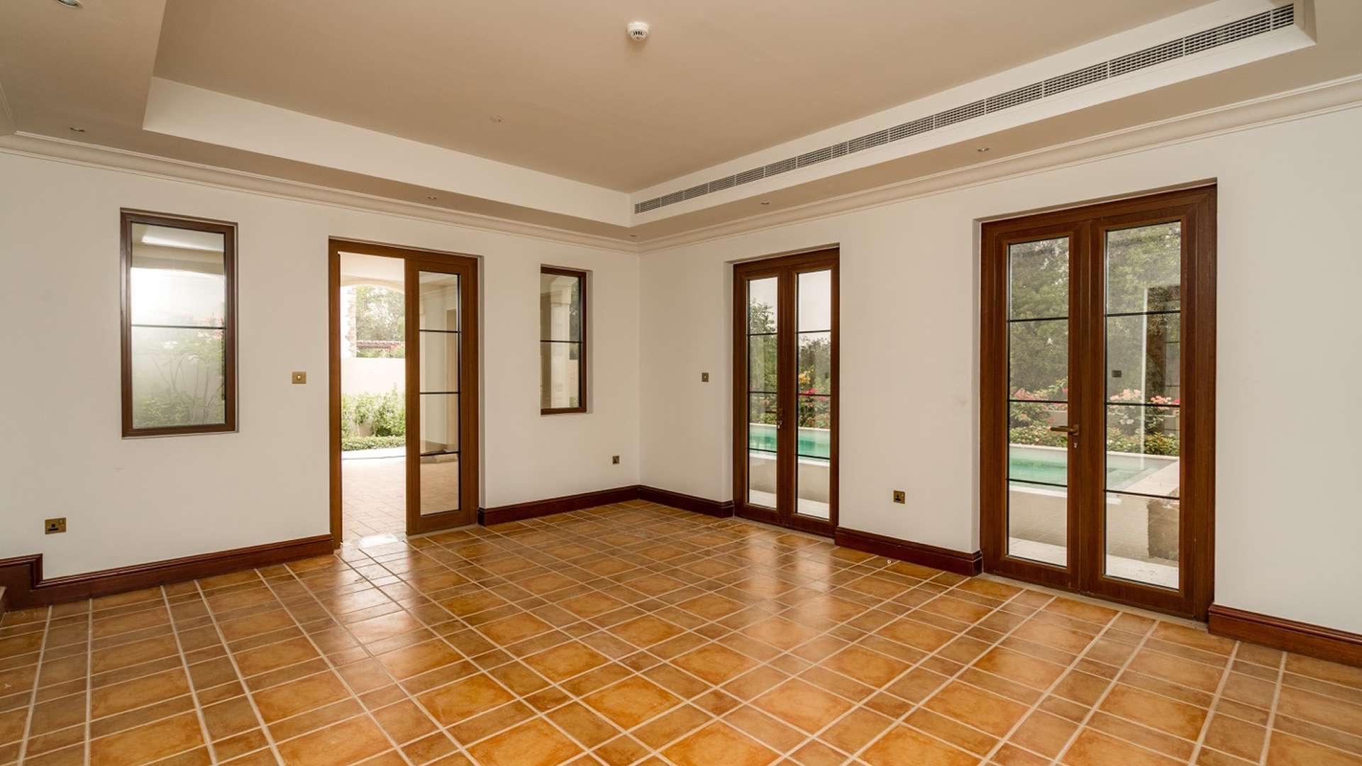 Hallway view in Zaragoza Villa, Lime Tree Valley, Jumeirah Golf Estates, with elegant tile flooring