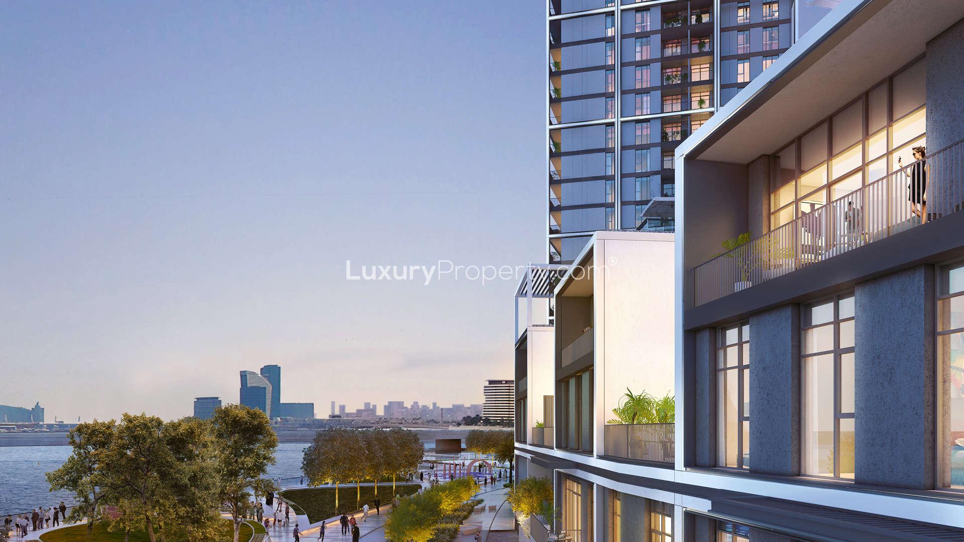 "Modern waterfront villas in Dubai Creek Harbour with city skyline and palm trees.",Luxurious waterfront villa exterior in Dubai Creek Harbour, overlooking scenic views and modern design