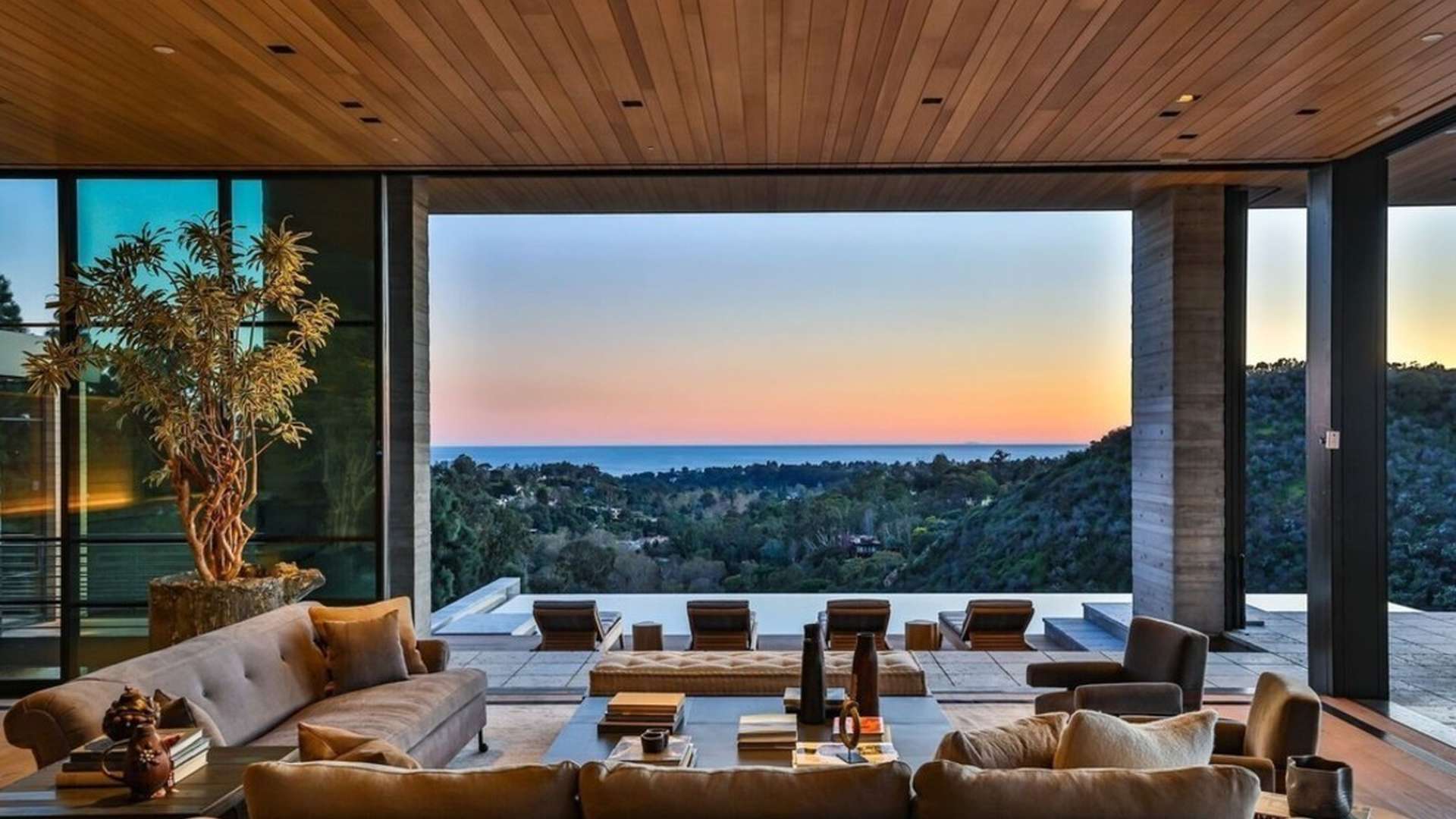 Luxurious living room in 7-bedroom Riviera Palisades villa with modern furnishings and warm lighting