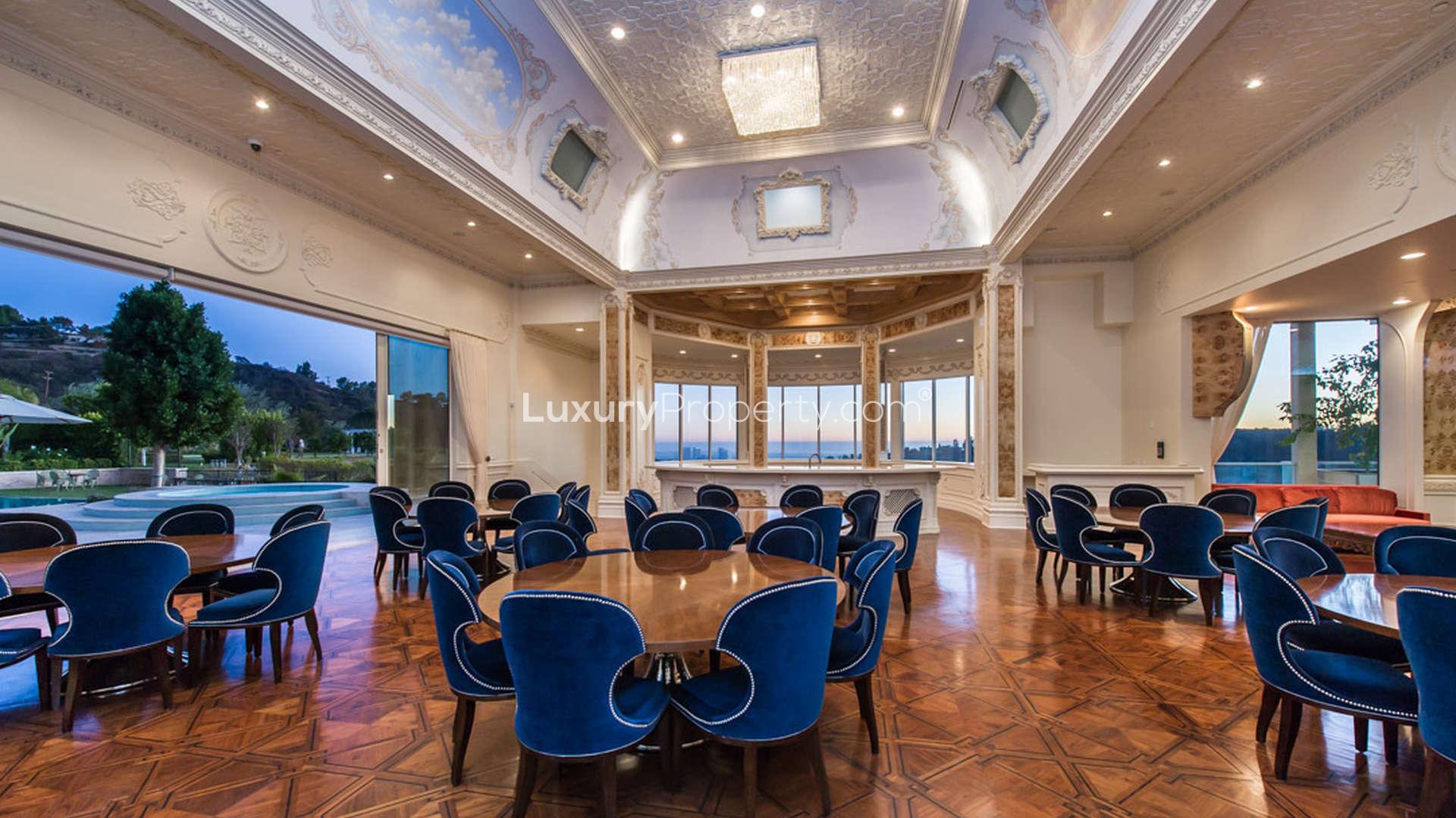 Mediterranean-style dining room in Beverly Hills villa, featuring chandelier and elegant decor