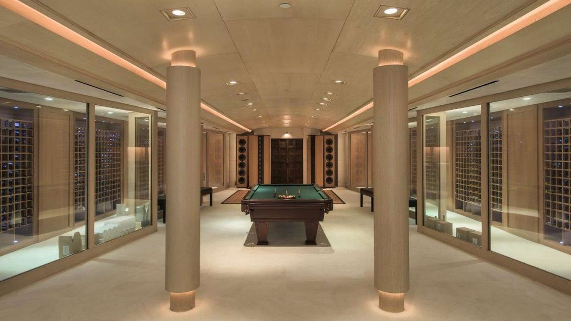 Luxurious Holmby Hills villa interior with fireplace, art, and bookshelves, Los Angeles