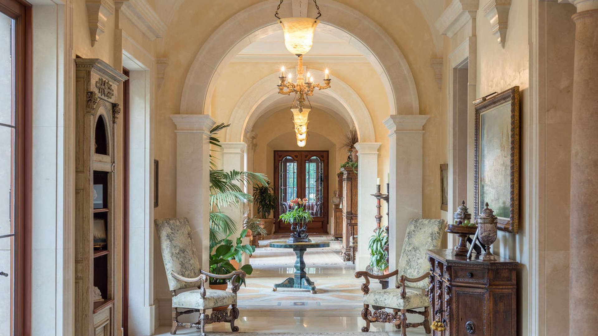 Luxurious living room in Beverly Hills villa with elegant decor and chandeliers