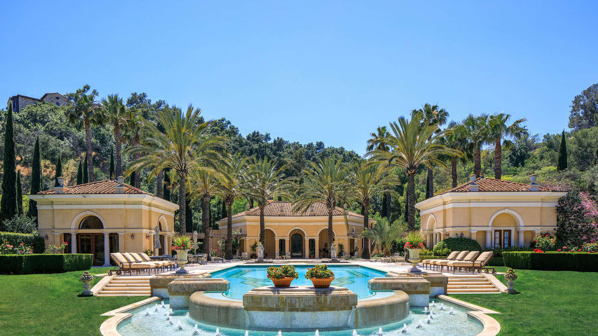 Luxurious Italian villa hallway with elegant arches and classic furnishings in Beverly Hills