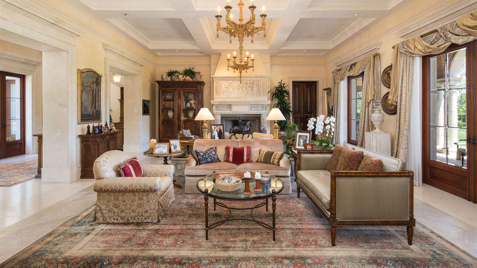 Charming Italian Villa in Beverly Hills with fountain and palm trees at sunset