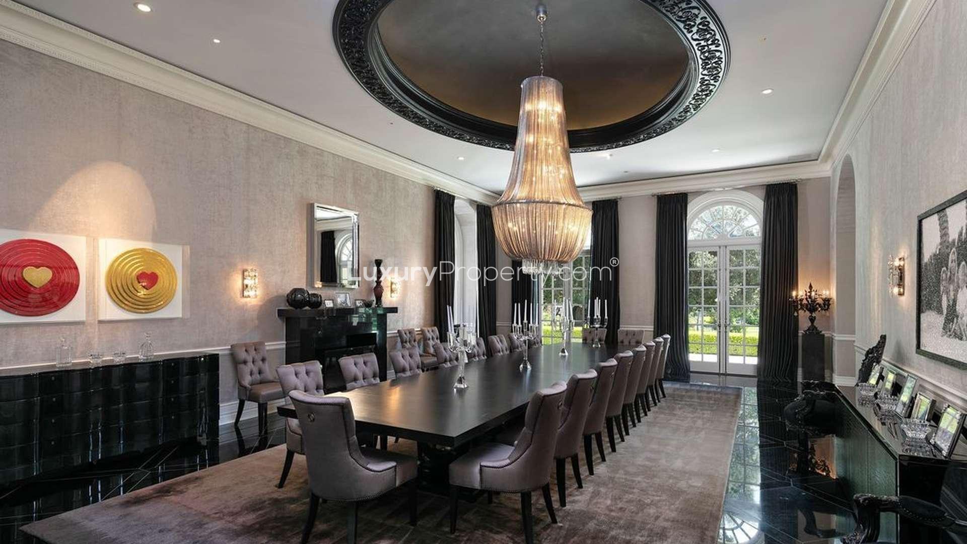 Luxurious living room in 15-bed villa, Los Angeles, featuring elegant decor and grand piano