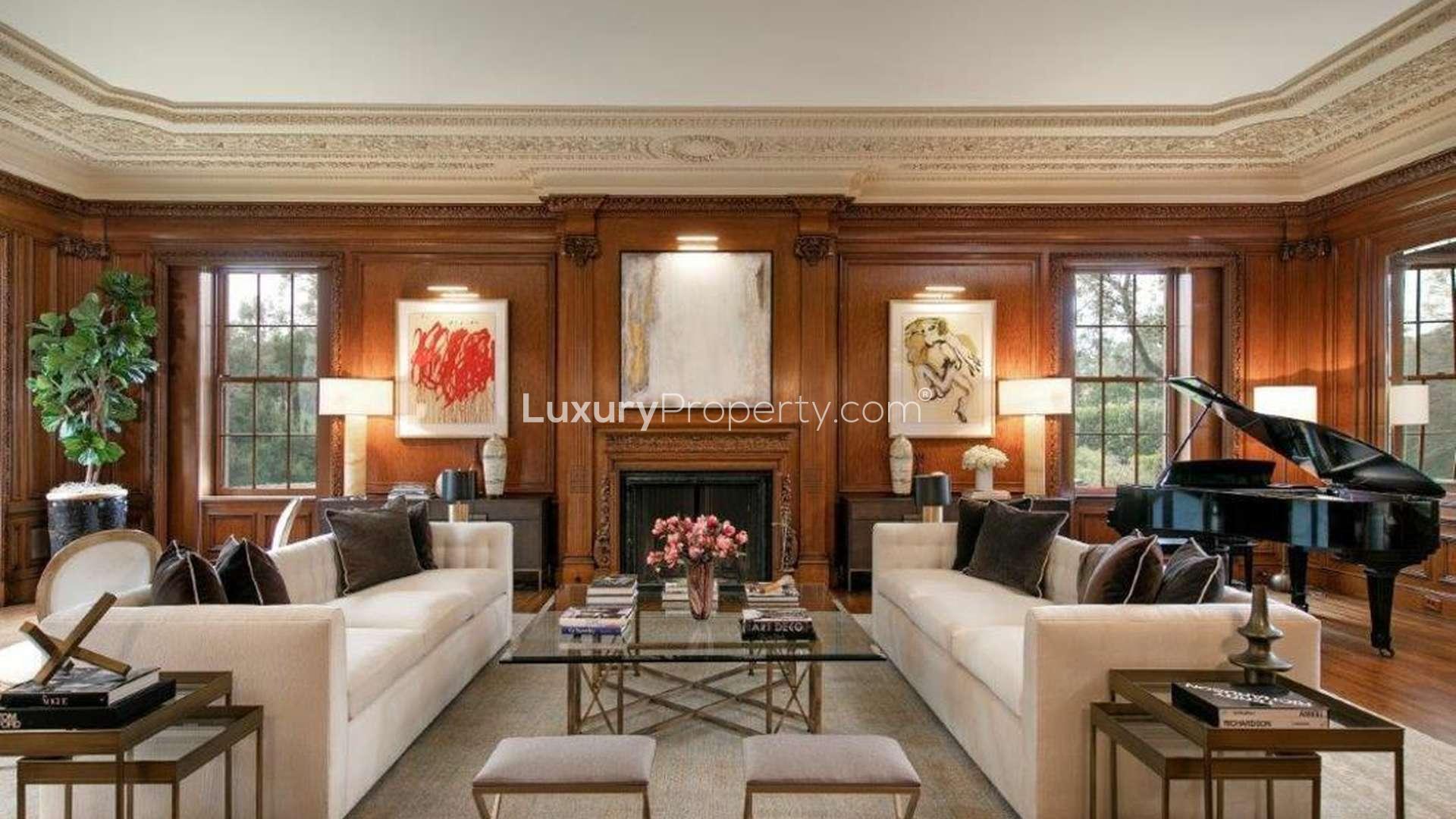 Grand nine-bedroom villa with driveway and fountain at 141 S Carolwood Dr, Los Angeles