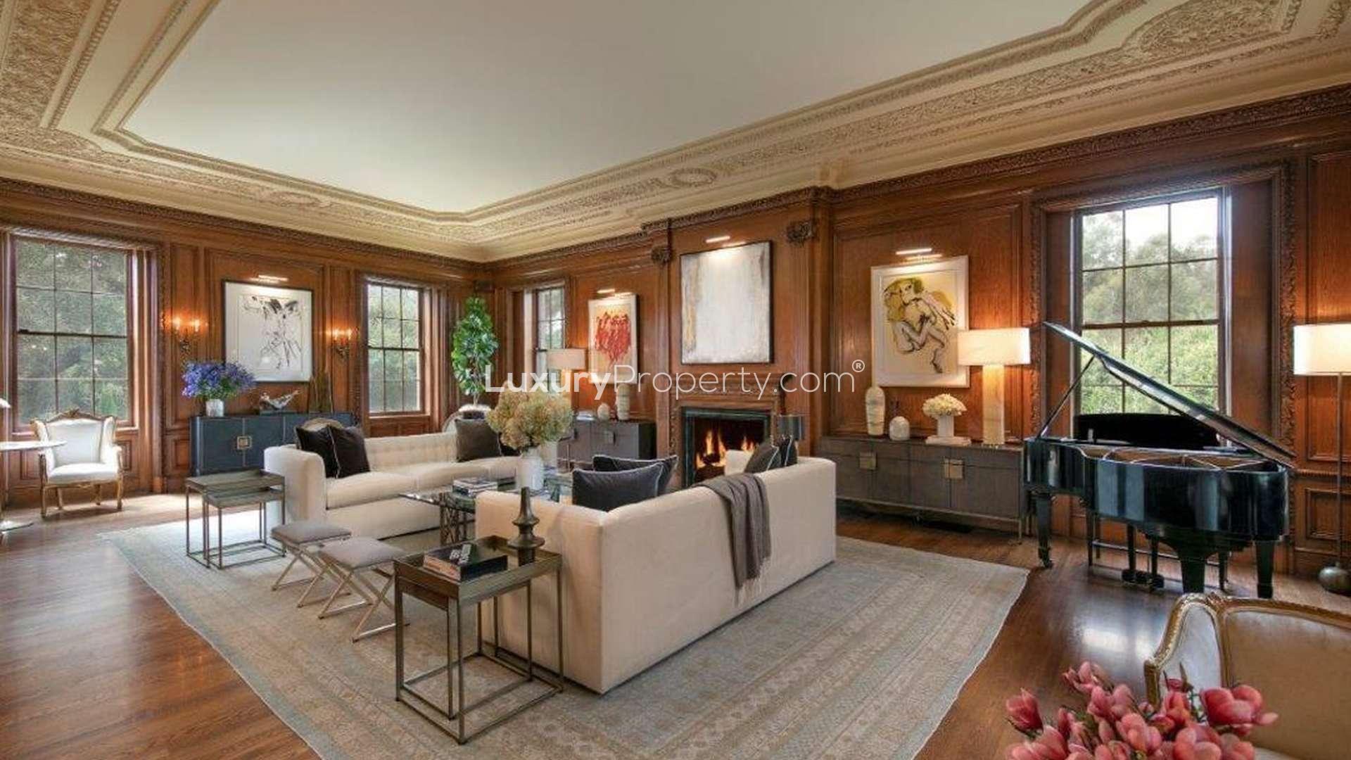 Luxurious living room in Holmby Hills villa with grand piano and elegant decor