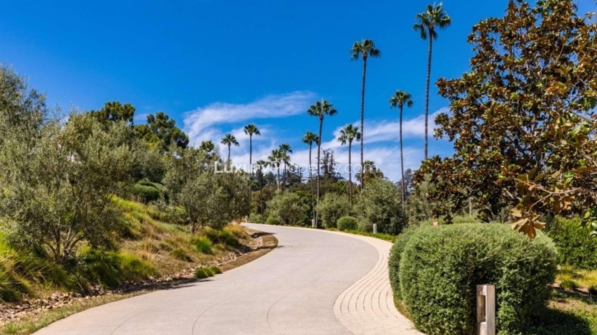 Aerial view of contemporary villa for sale at 911 n Foothill Rd, Beverly Hills