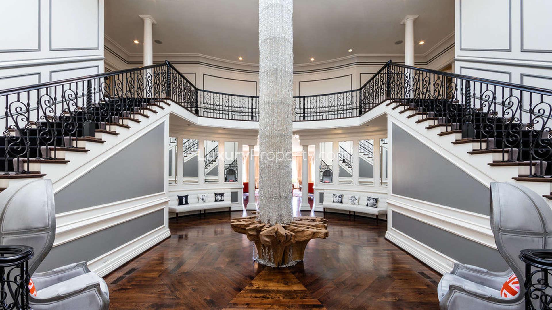 Luxurious villa at 10250 W Sunset Boulevard, Holmby Hills, with elegant architecture and gardens