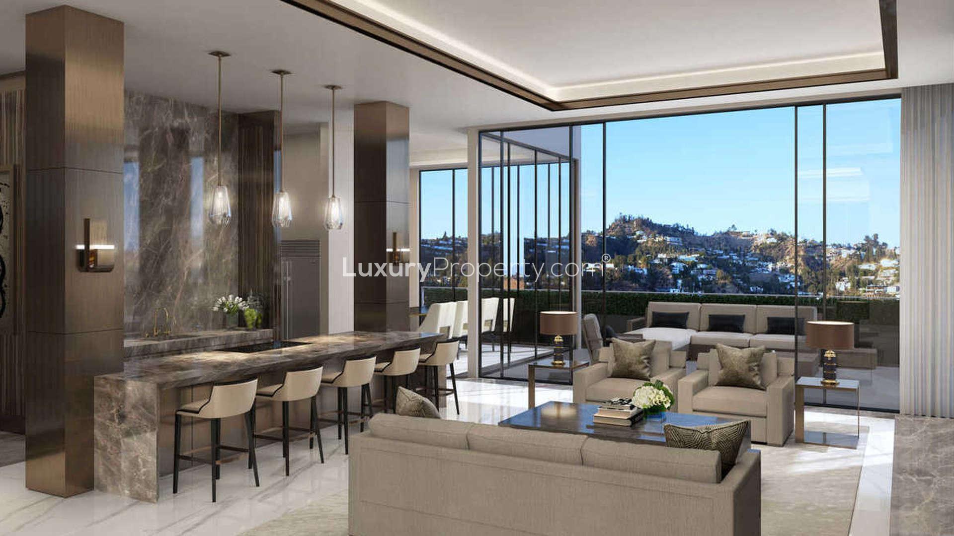 Luxurious West Hollywood penthouse living room with city skyline views at night