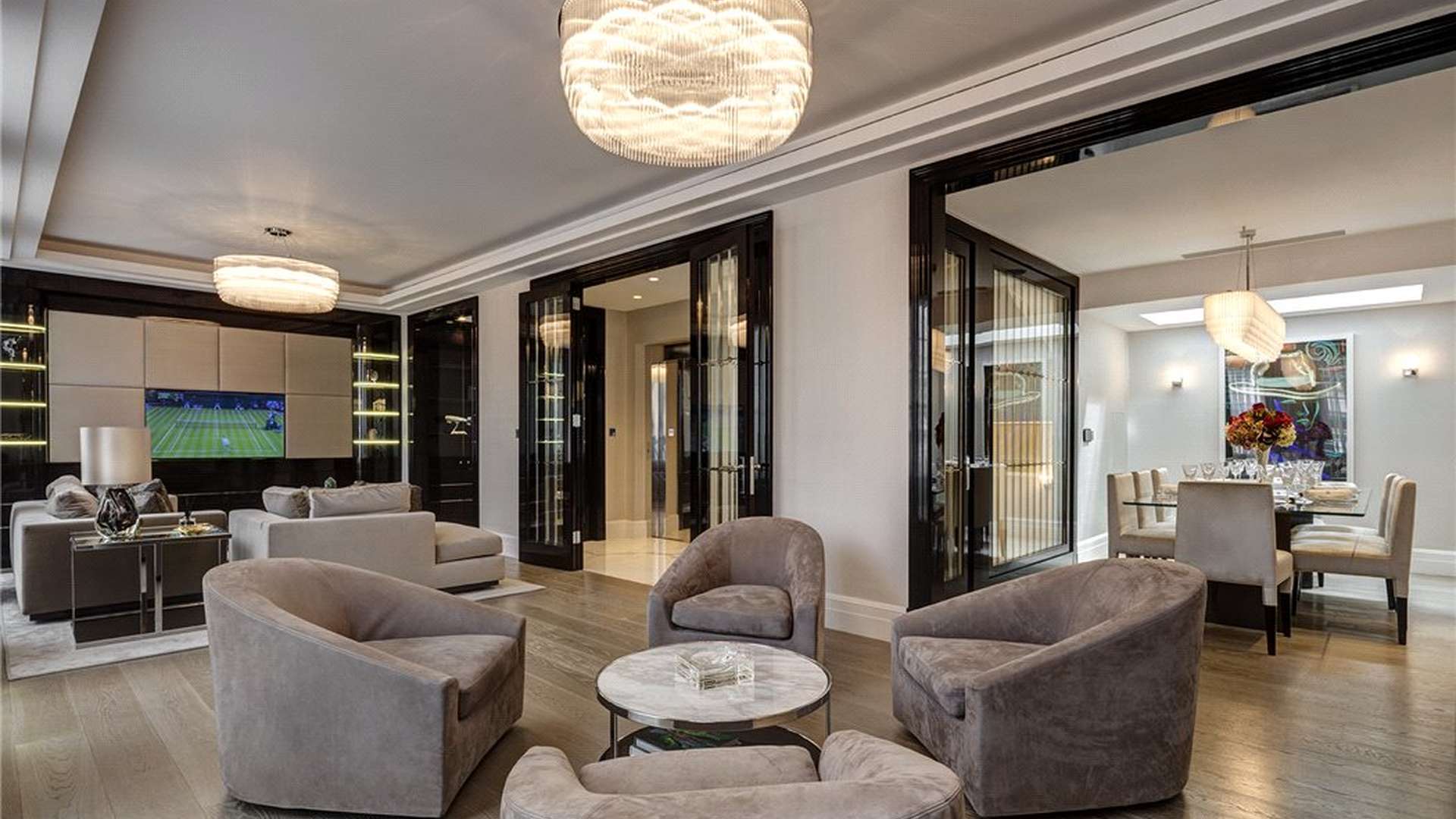 Luxurious living room in five-bedroom Mayfair townhouse with elegant decor and plush furnishings