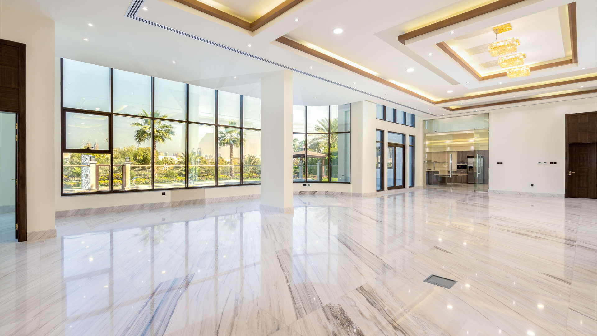 Grand staircase in luxurious Emirates Hills villa, featuring elegant design and chandelier