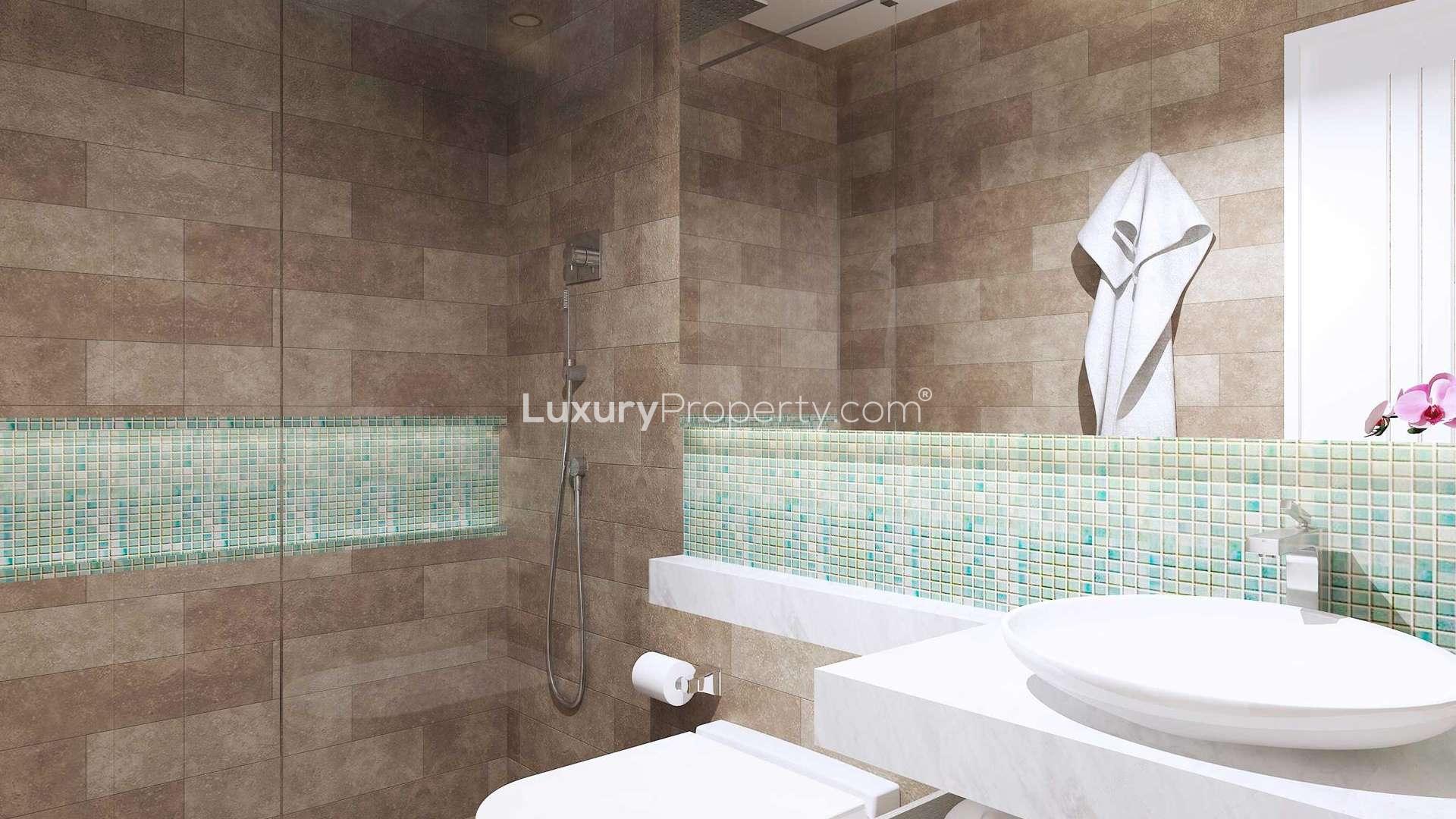 Modern kitchen in 2 BR Palm Jumeirah apartment, Seven Residences, with sleek cabinetry