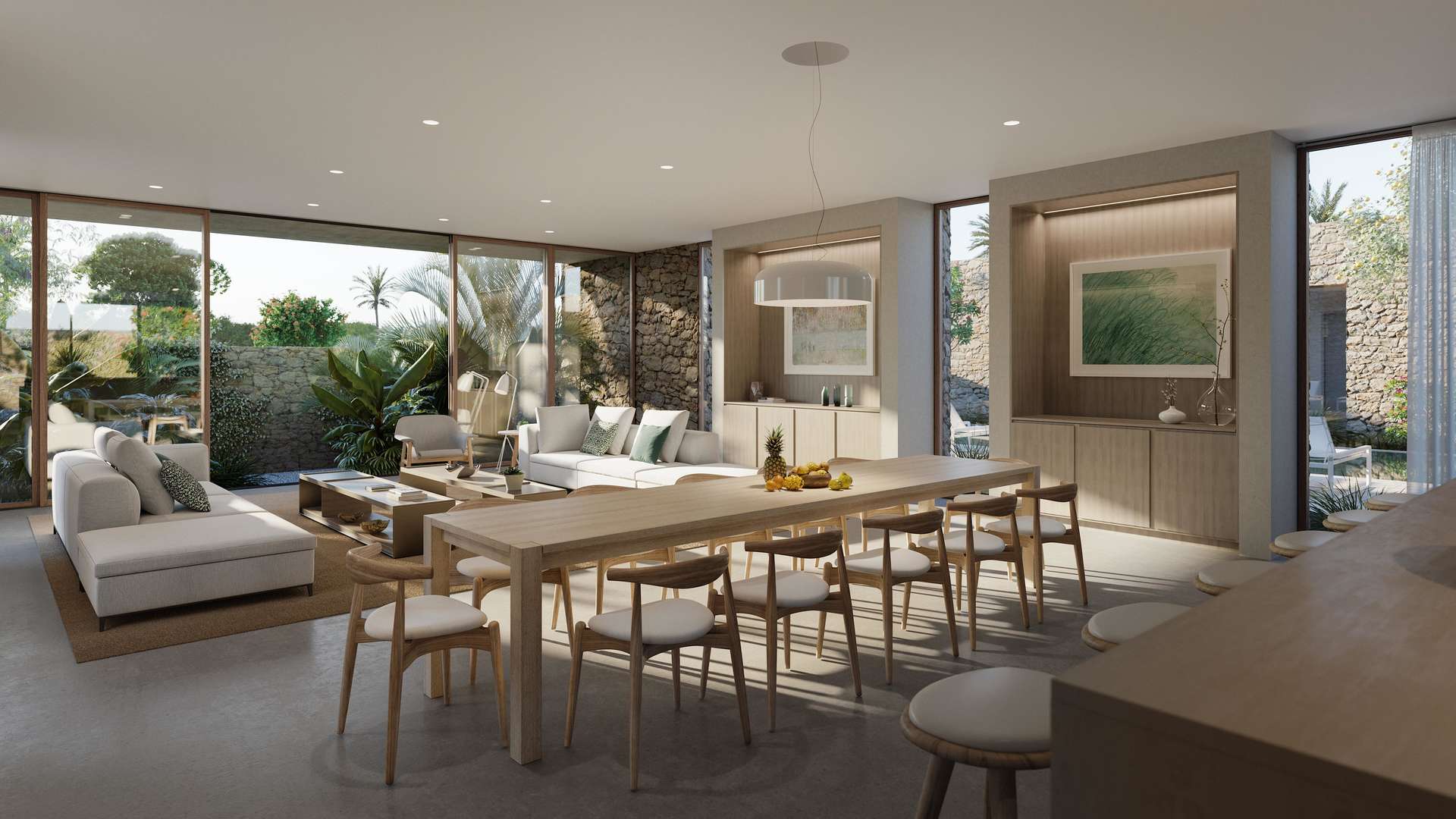 Modern open-plan living area in Al Jurf Gardens villa with garden view and sleek kitchen