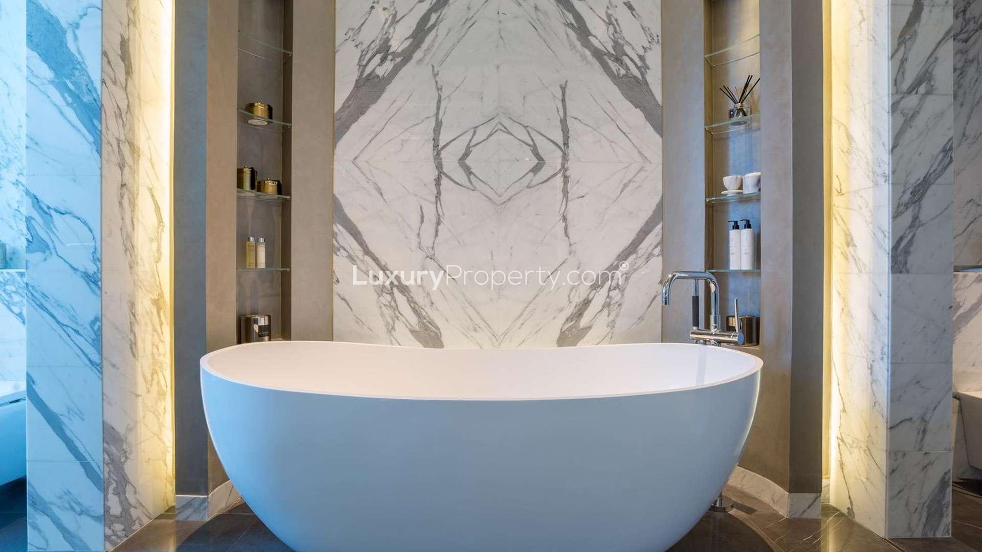 Luxury bedroom in duplex penthouse at The 118 Downtown, Dubai, with skyline views