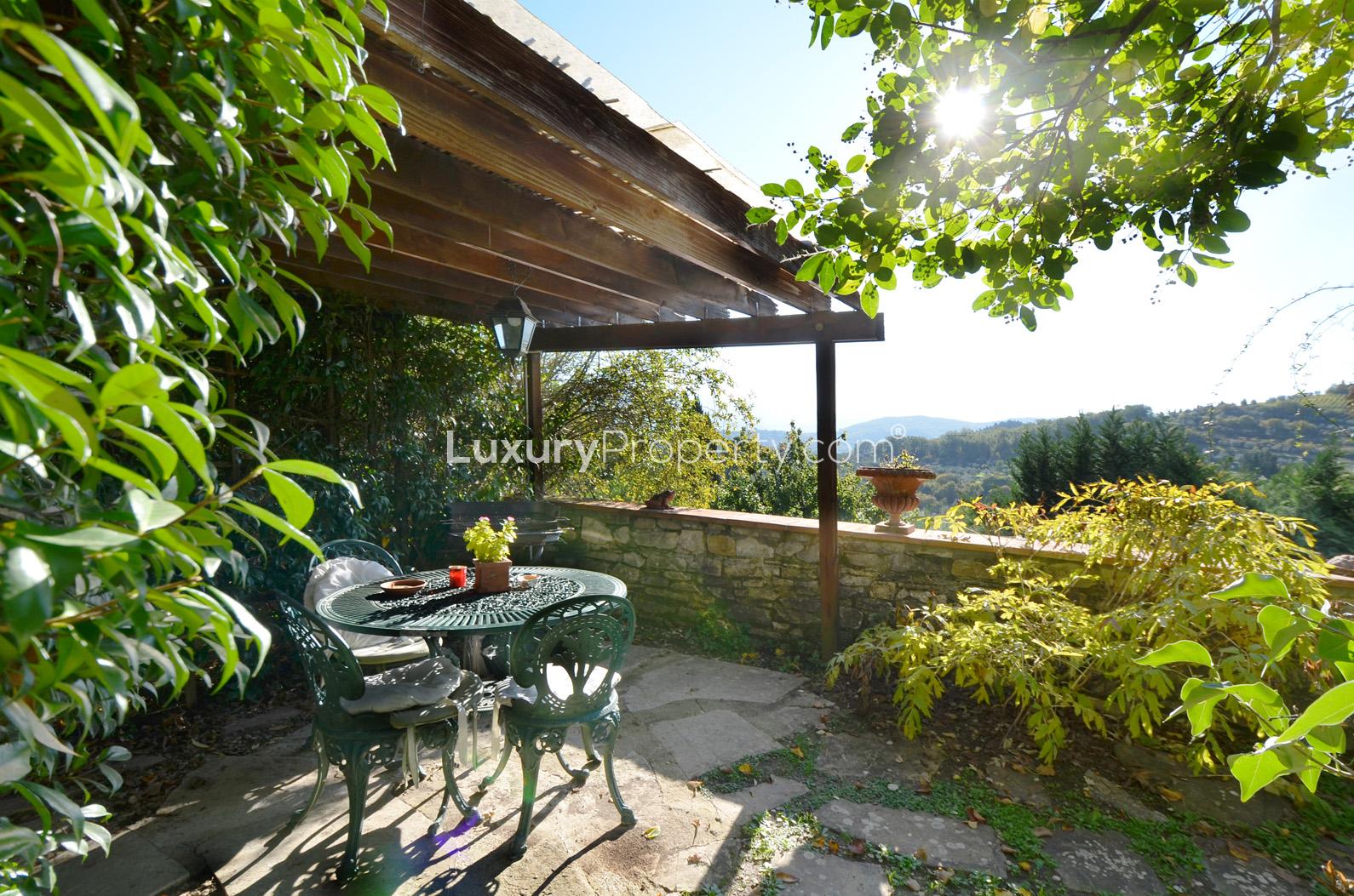 Rustic kitchen in 7-bedroom villa, Florence Tuscany countryside, wooden beams, cozy dining table