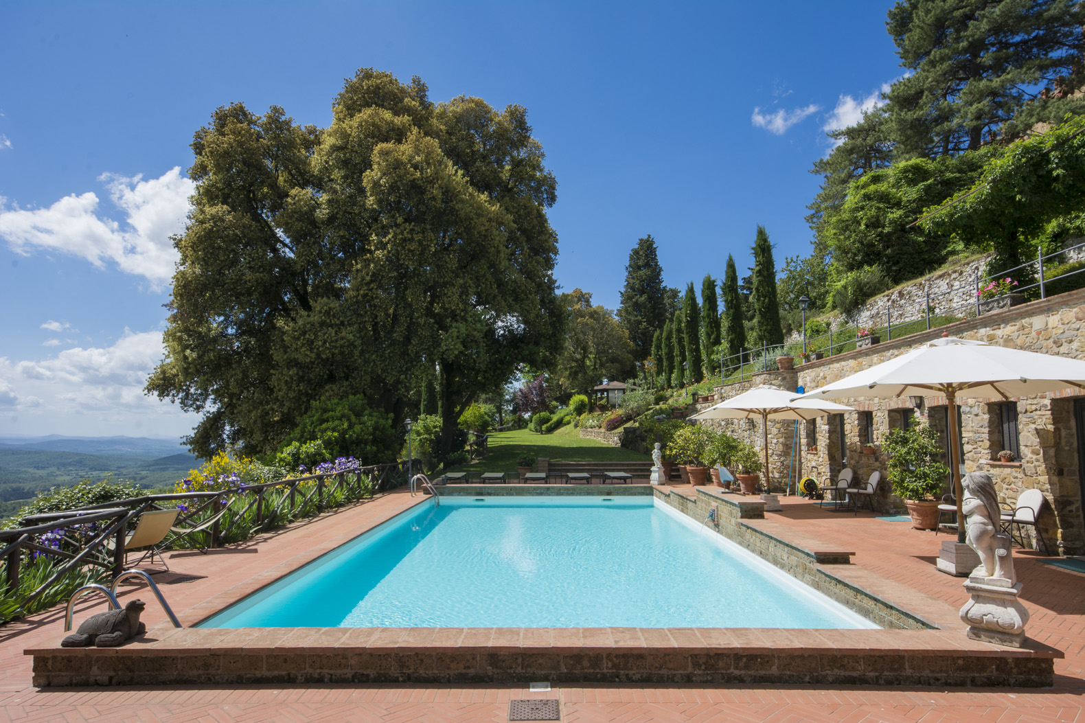 Luxurious bedroom in Tuscany villa, Castello Del Conte, with elegant decor and ensuite bathroom