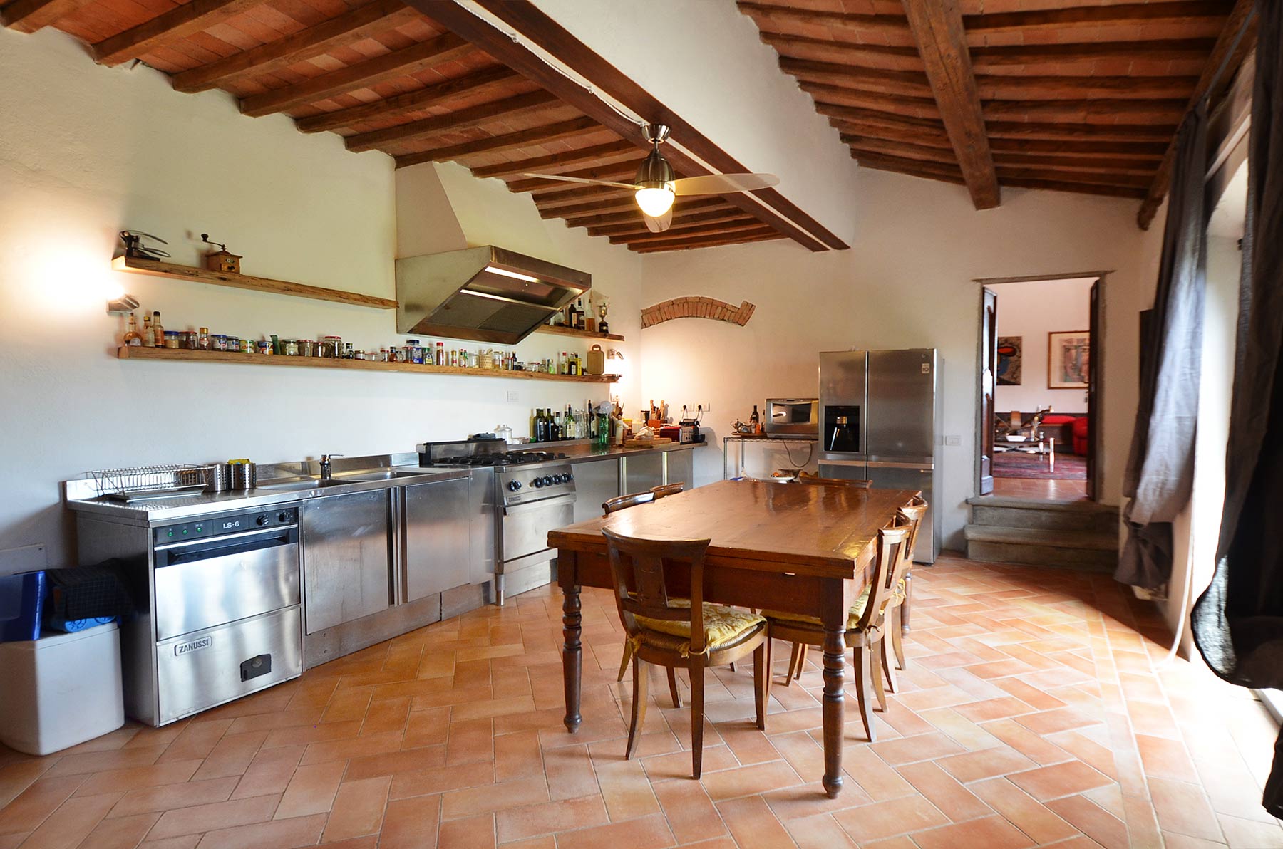 Rustic interior of Tuscany villa with wooden beams and antique furniture in Florence