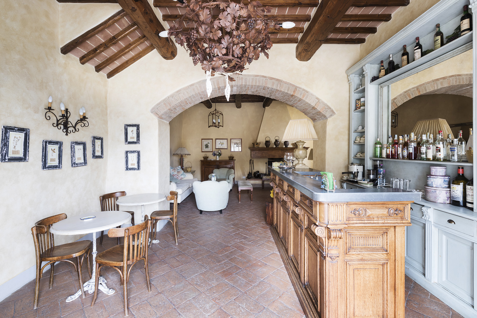 Charming Chianti villa hallway with rustic stone wall and wooden ceiling beams