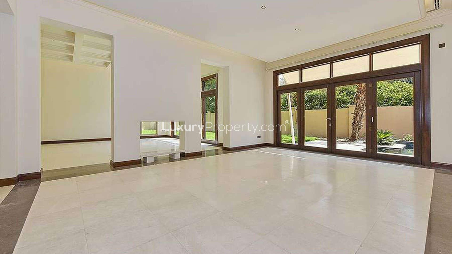 Spacious entrance hall of luxury villa in Al Barari, Dubai, with elegant columns