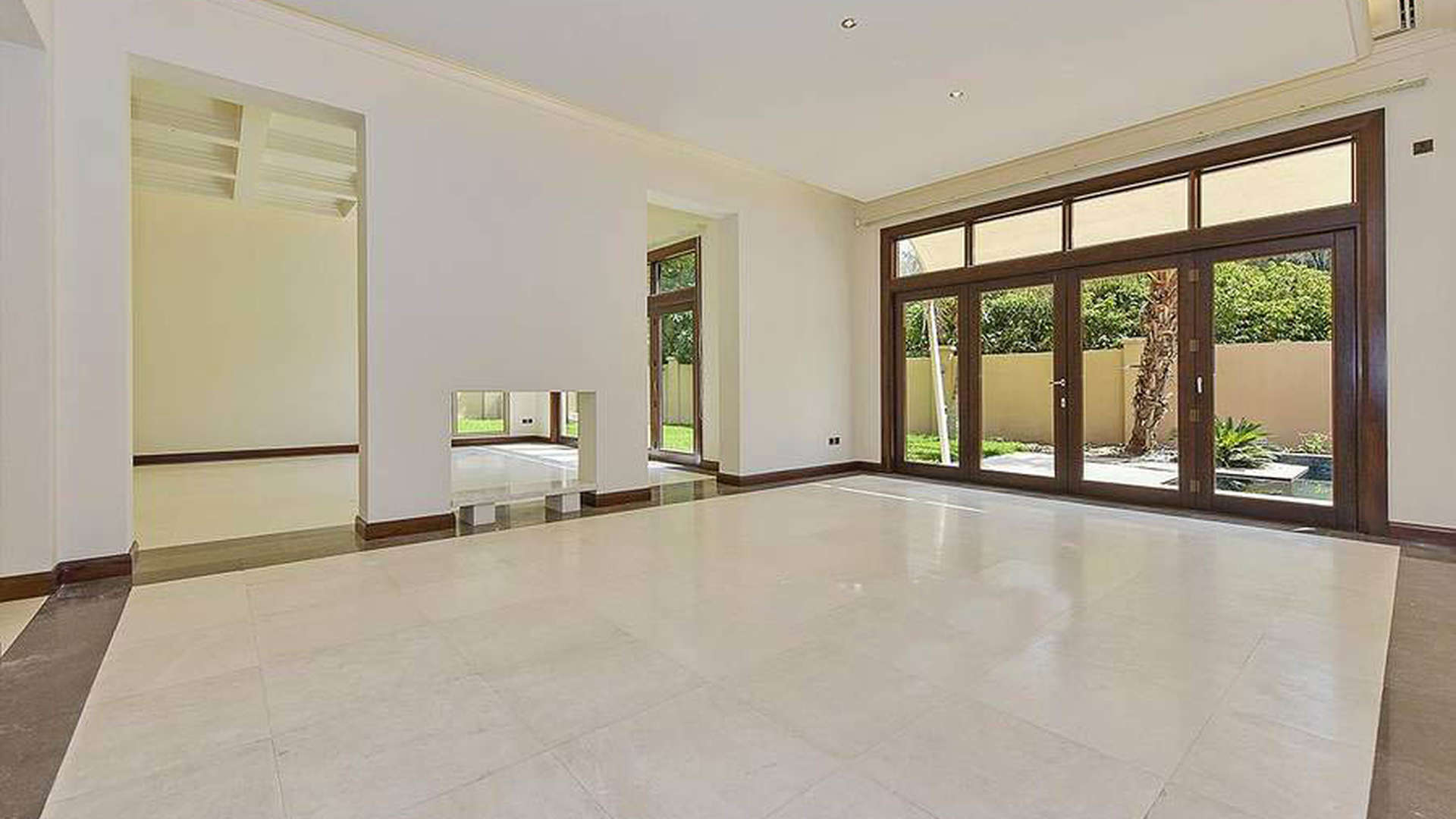 Spacious entrance hall of luxury villa in Al Barari, Dubai, with elegant columns