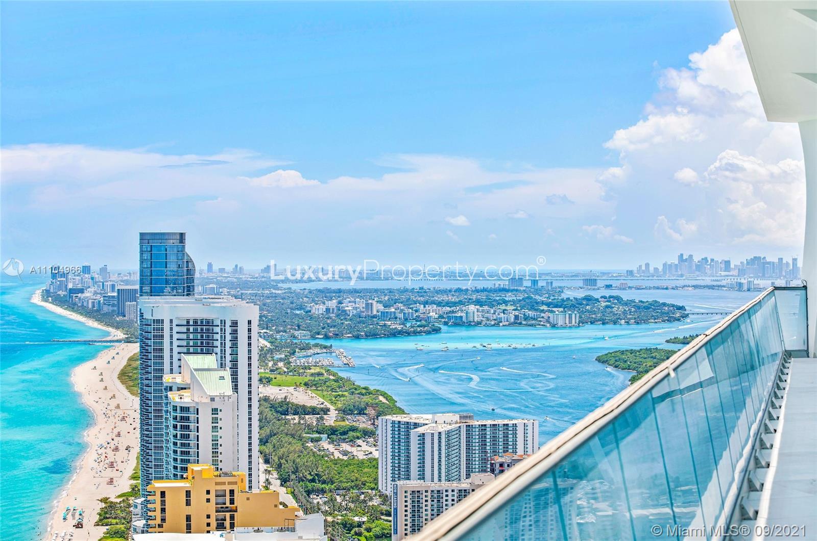 "Stunning Miami oceanfront view from luxury penthouse at 16901 Collins Ave PH-5503.",Miami oceanfront view from penthouse balcony at 16901 Collins Ave, PH-5503