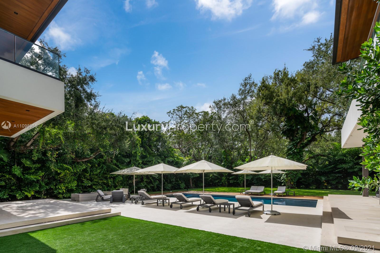 Modern staircase with glass railing in luxury villa, 5400 Hammock Dr, Coral Gables, Miami