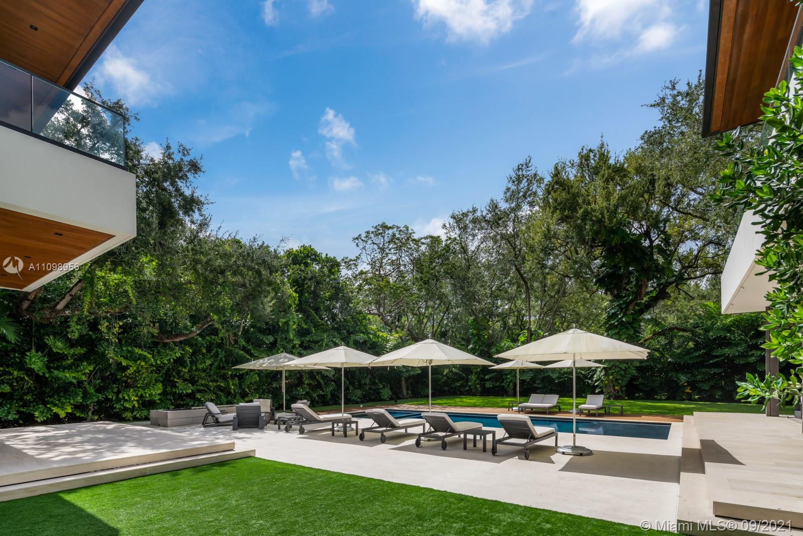 Modern staircase with glass railing in luxury villa, 5400 Hammock Dr, Coral Gables, Miami