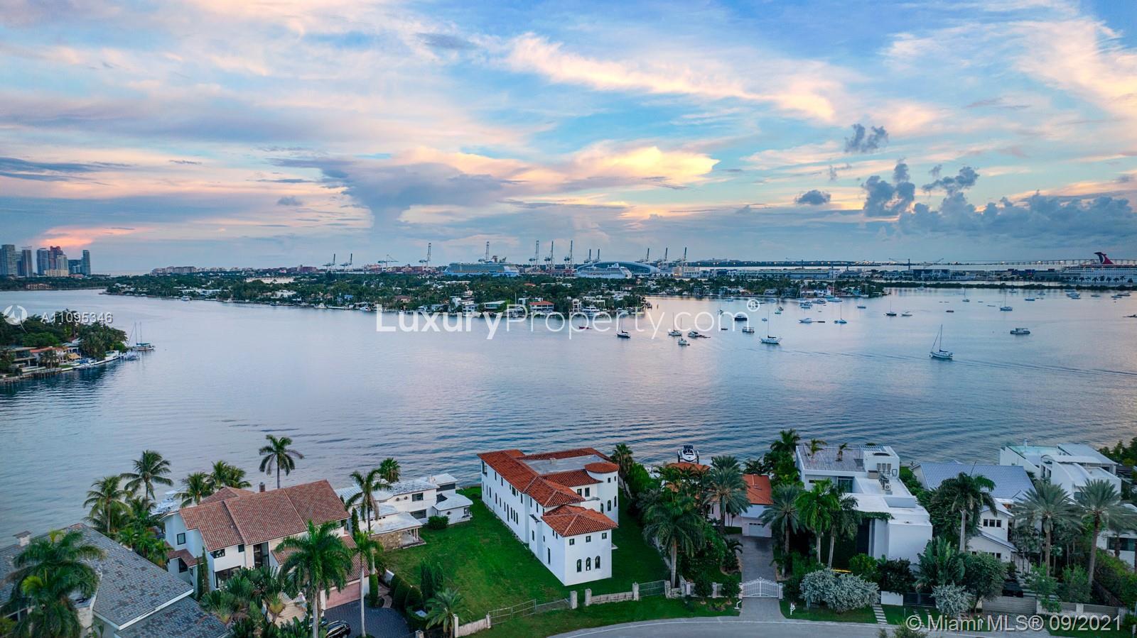 Exterior view of Miami villa on Venetian Islands waterfront at sunset