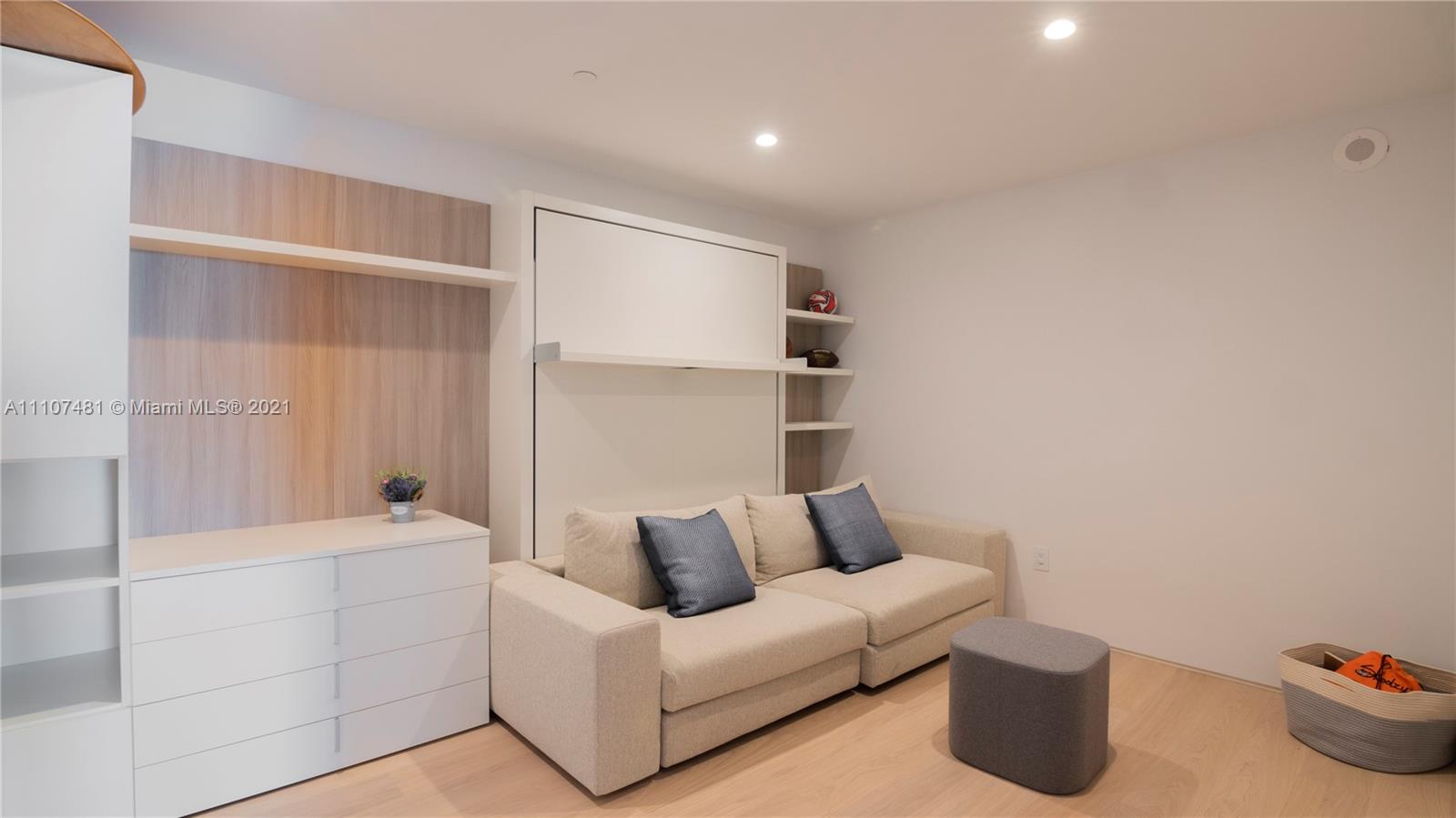 Modern bathroom in Miami Beach villa with glass shower and elegant fixtures