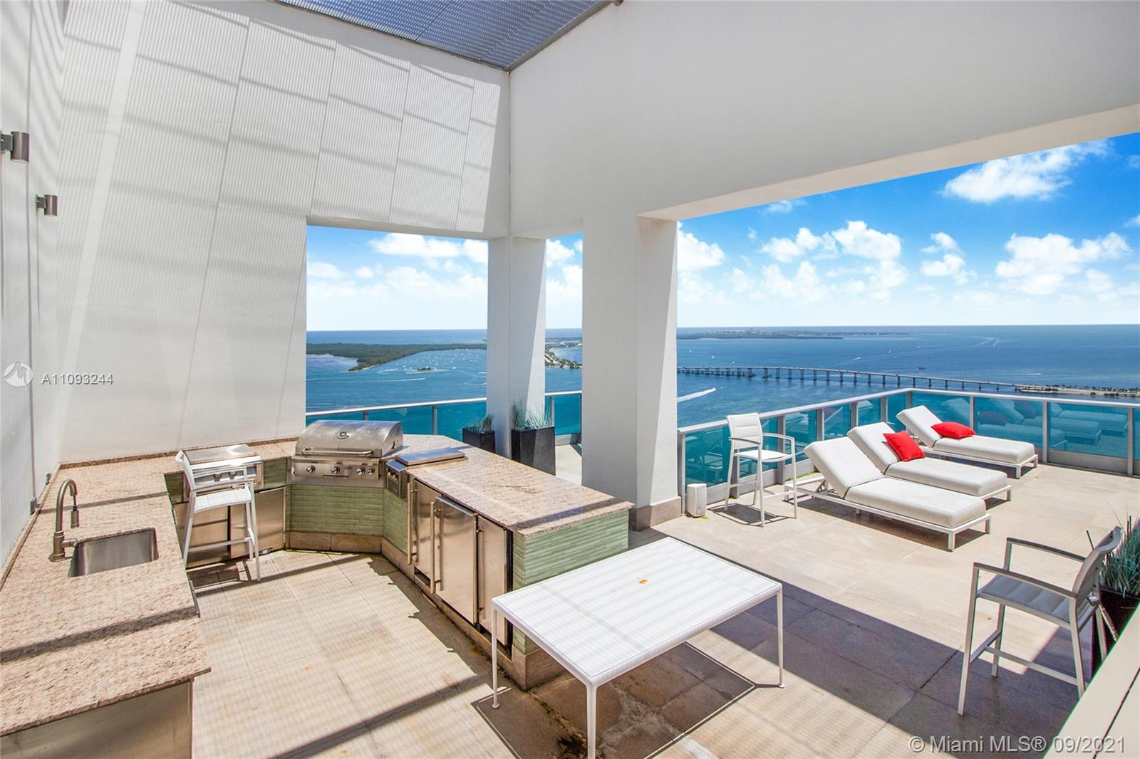 Penthouse balcony with stunning ocean views at sunset, Miami Beach, Florida