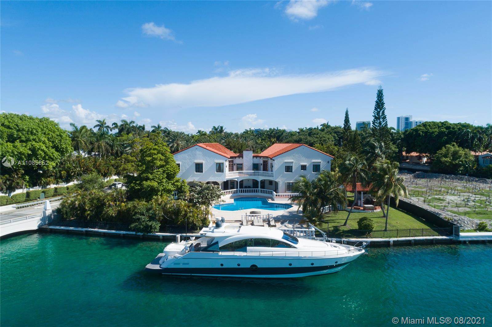 Aerial view of waterfront lot on Star Island, Miami Beach, with city skyline backdrop