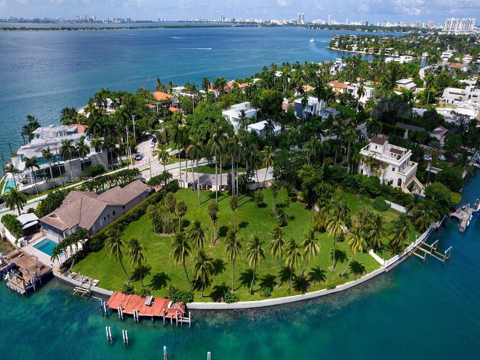 Aerial view of waterfront lot for sale on San Marco Island, Miami, with lush surroundings