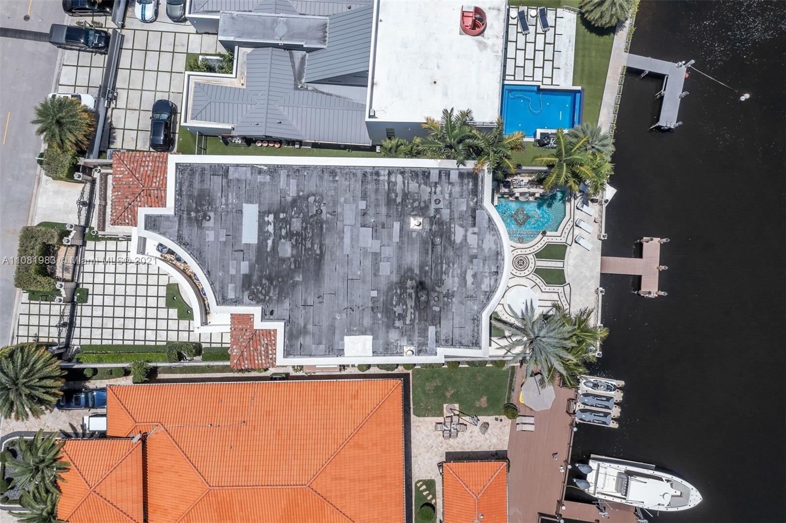 Elegant eight-bedroom villa in Miami, Florida, featuring Mediterranean architecture and lush landscaping