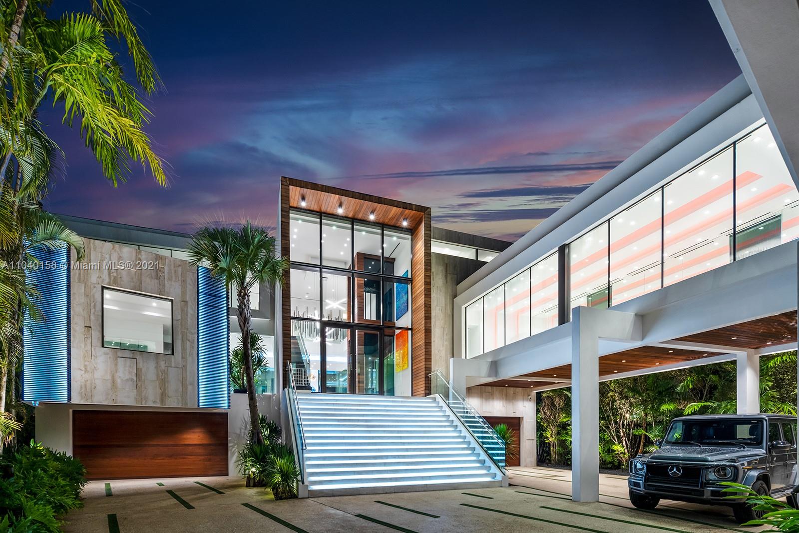 Luxurious three-story villa exterior with modern design at Belle Meade Island, Miami