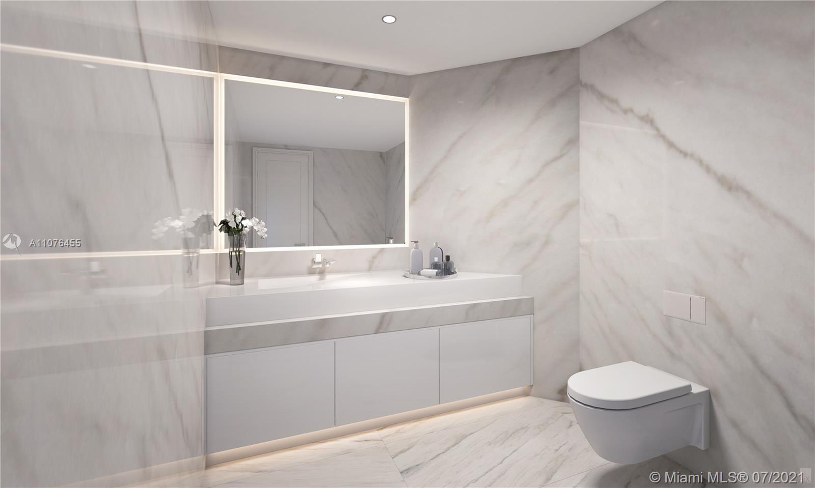 Luxurious marble bathroom in Sunny Isles Beach villa, featuring modern fixtures and elegant design