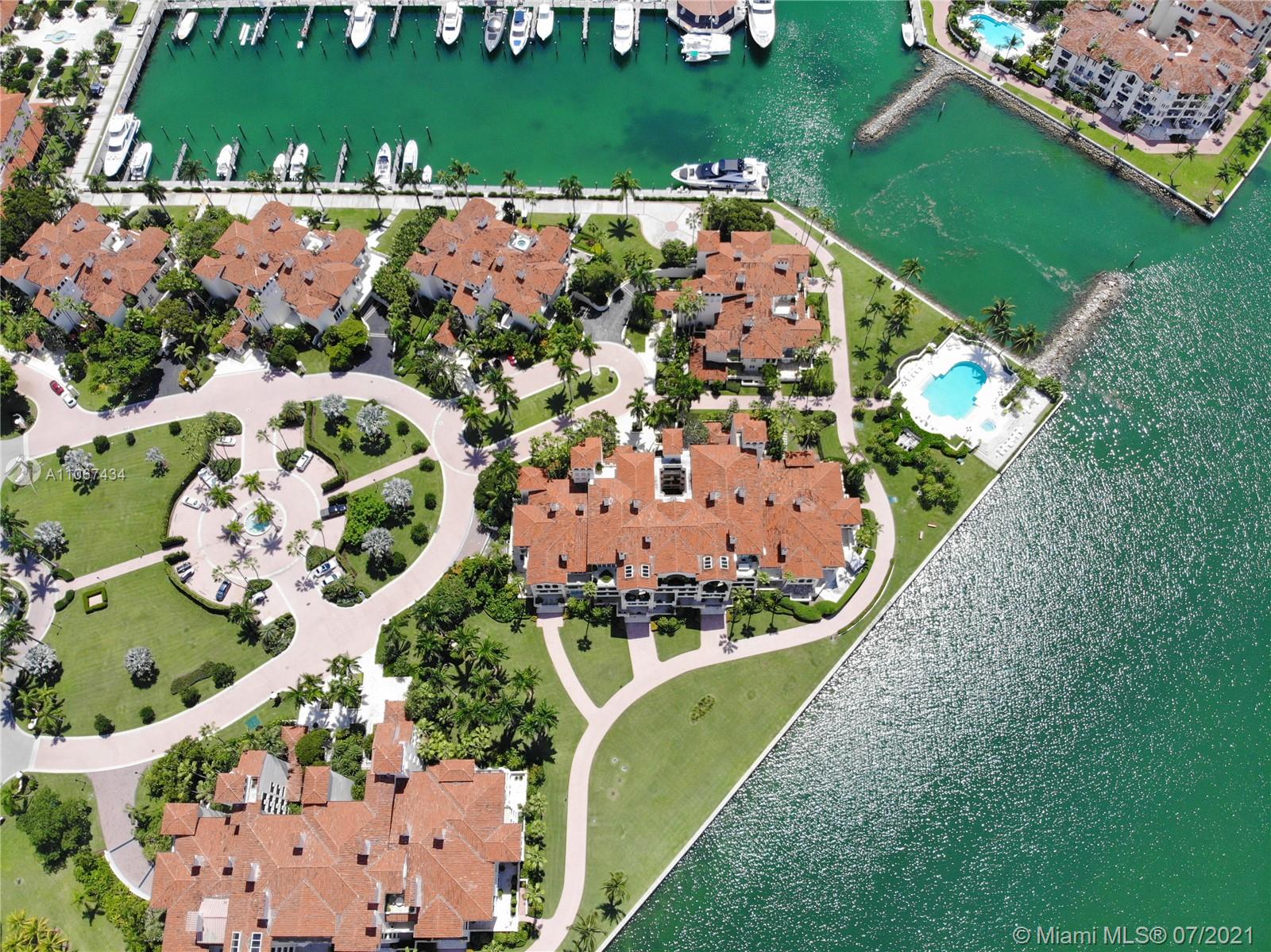 Aerial view of Miami Beach Villa on Fisher Island, lush golf course, ocean backdrop