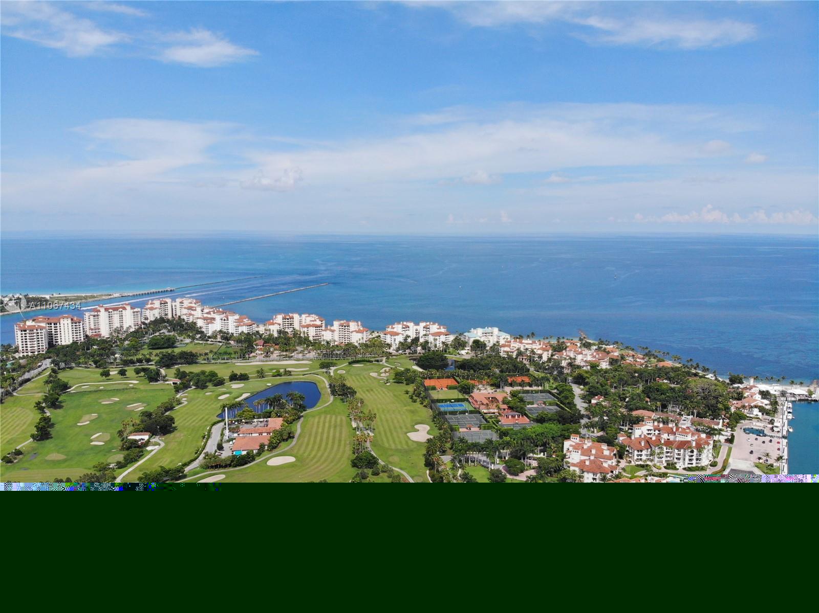 Balcony view from Miami Beach Villa overlooking ocean and skyline at sunset