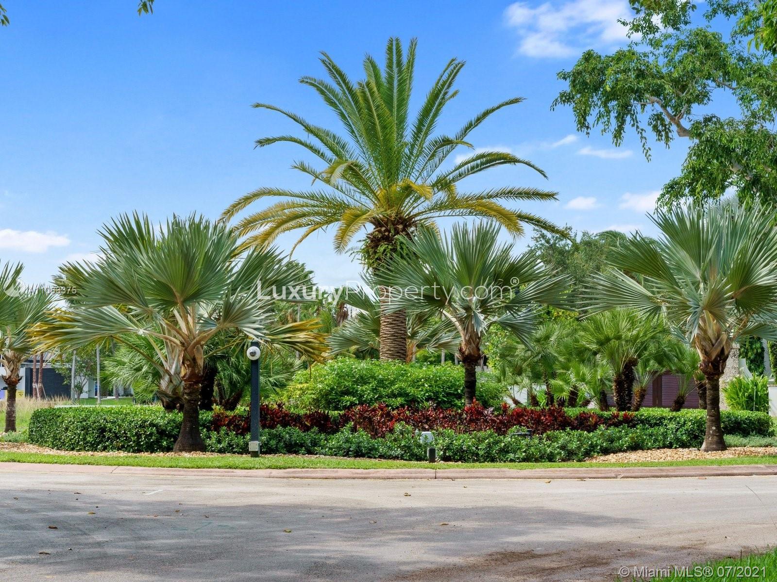 N/A,Prime waterfront villa lot with lush palm trees in Coral Gables, Miami, Florida