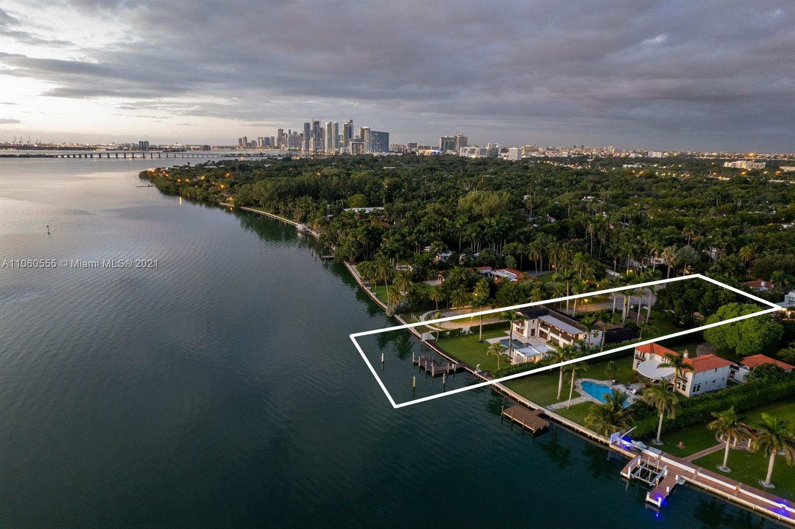 Aerial view of luxury villa for sale in Miami, Florida with waterfront and pool