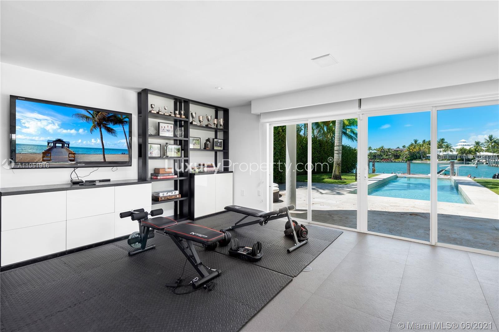Outdoor patio of six-bedroom villa with canal views in Key Biscayne, Miami