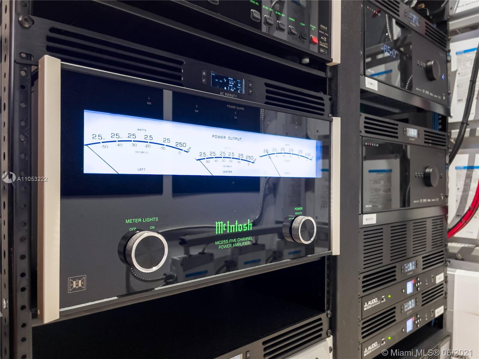 Laundry room with stacked washer-dryer in Surfside Miami waterfront villa, LP09798
