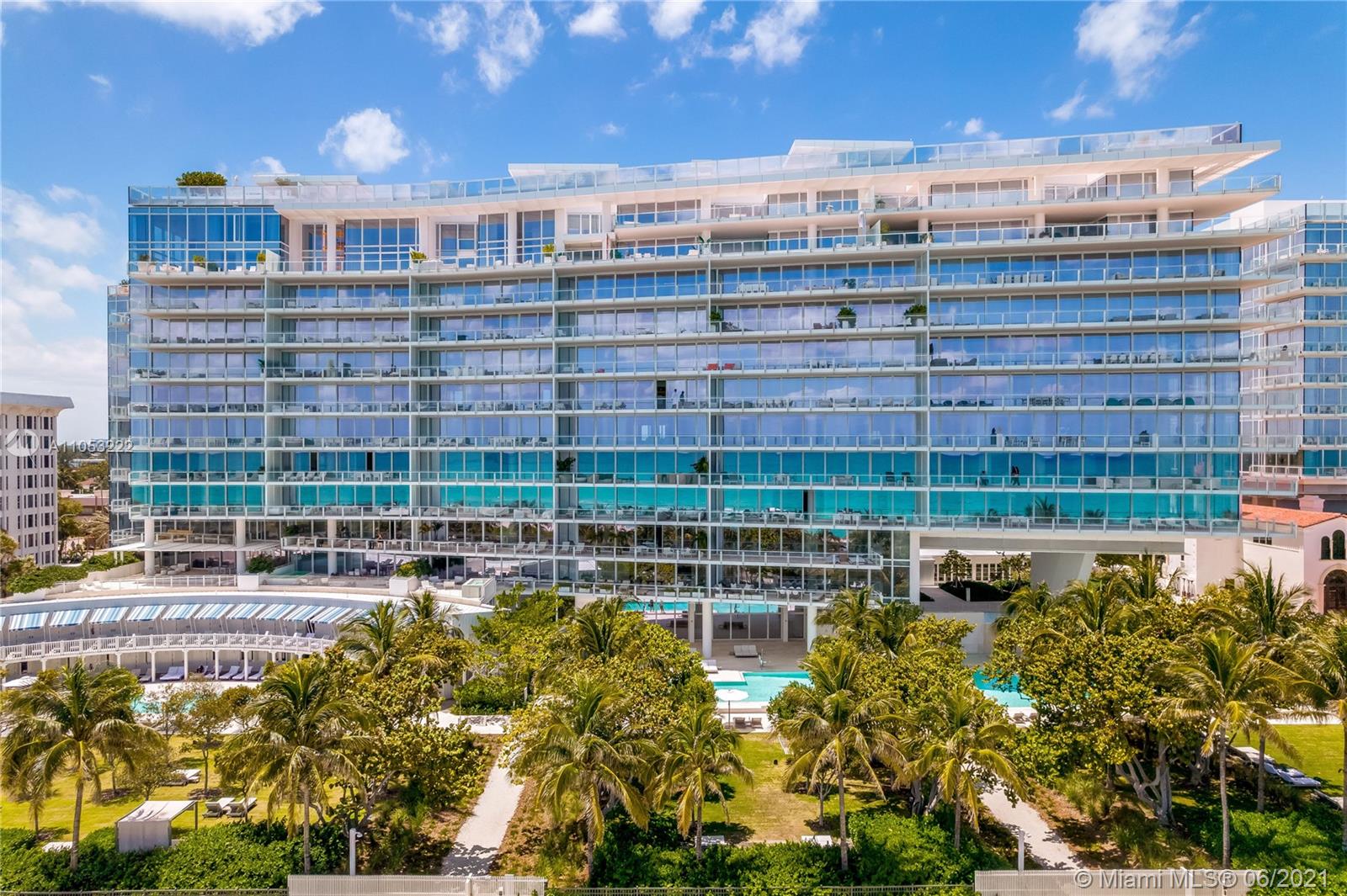 "Modern waterfront villa in Surfside, Miami with lush greenery and ocean views.",High-end audio system in luxury Surfside Miami villa, Ref No: LP09798